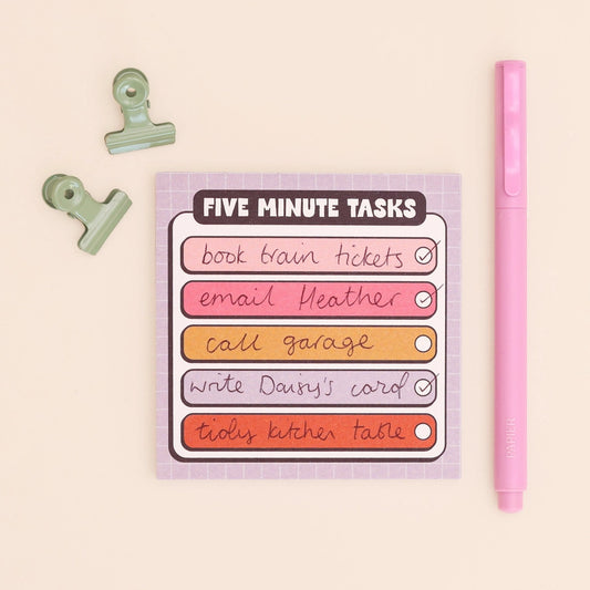 Note pad with 'Five Minute Tasks' list on a beige background with a pink pen and green clip.