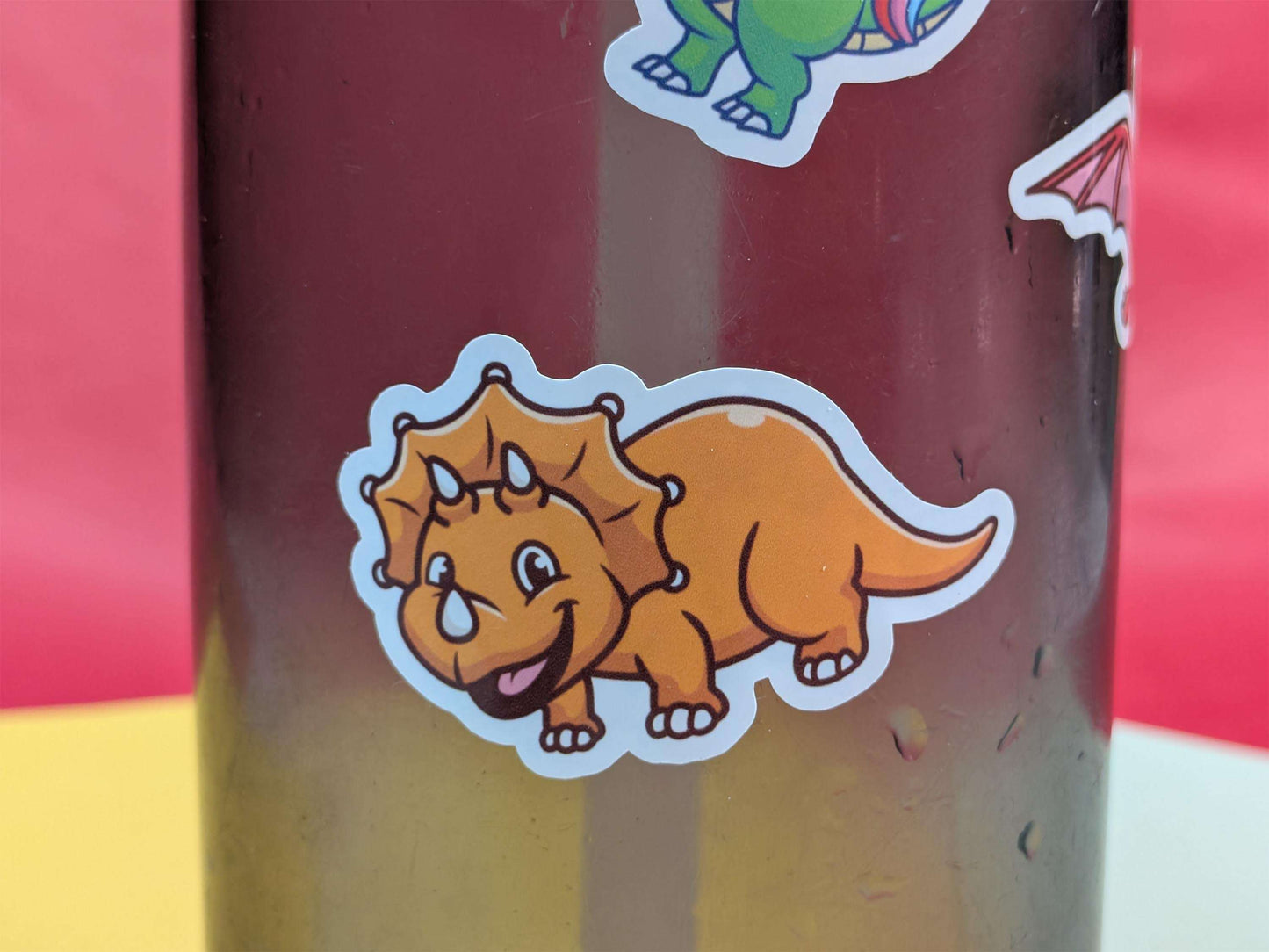 Dinosaur sticker on a colorful background