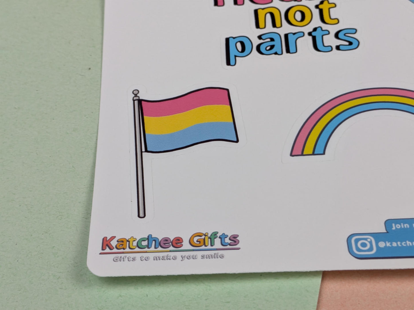 Sticker sheet with a pride flag and rainbow design, featuring Katchee Gifts branding.