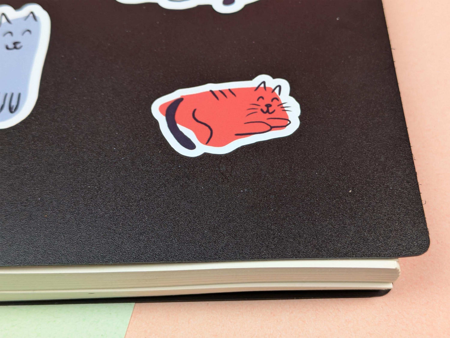 Notebook with a red cat sticker