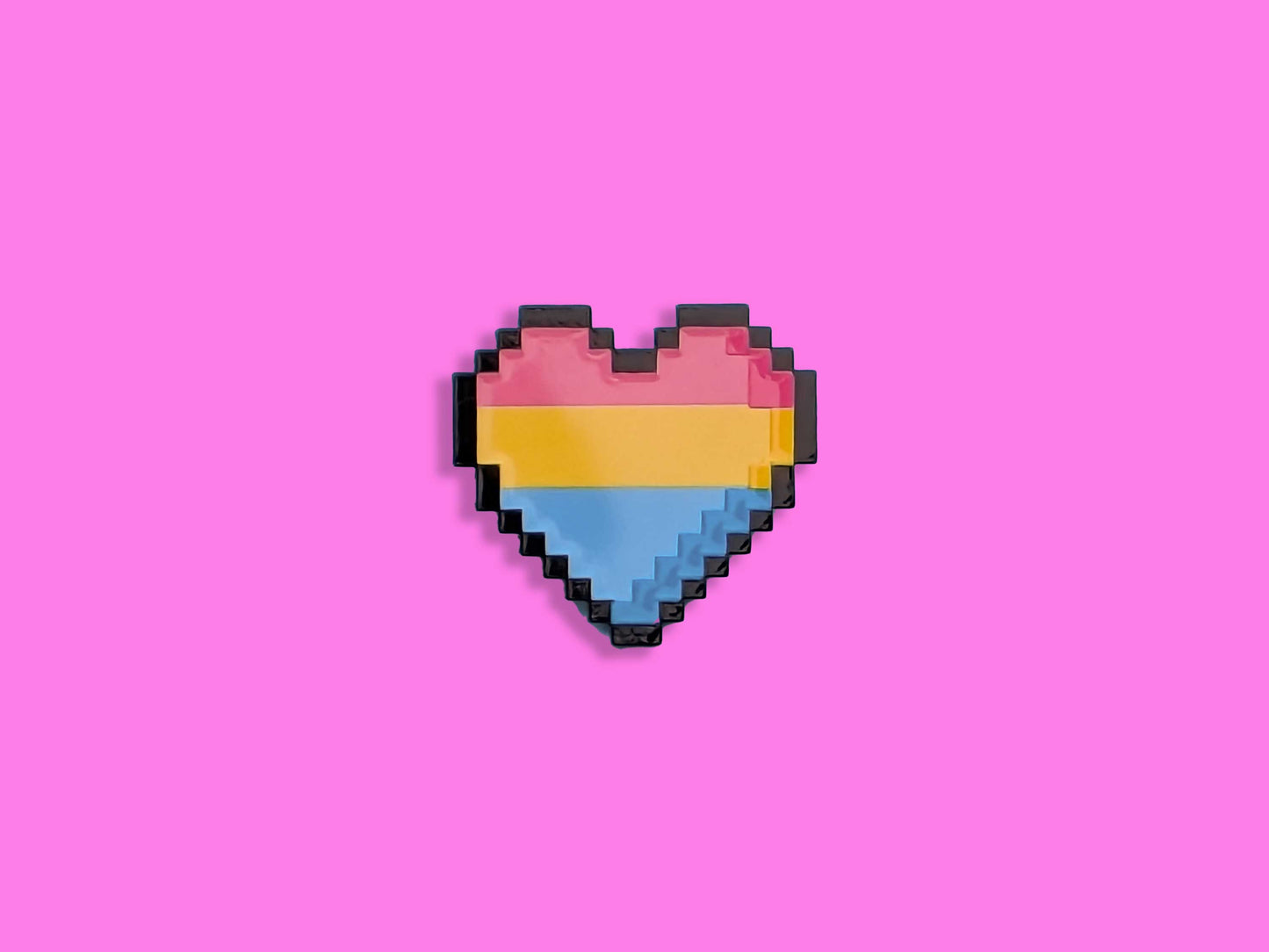 Pixelated heart-shaped flag with pink, yellow, and blue colors on a pink background