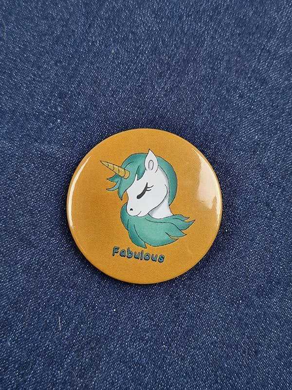 Yellow unicorn badge