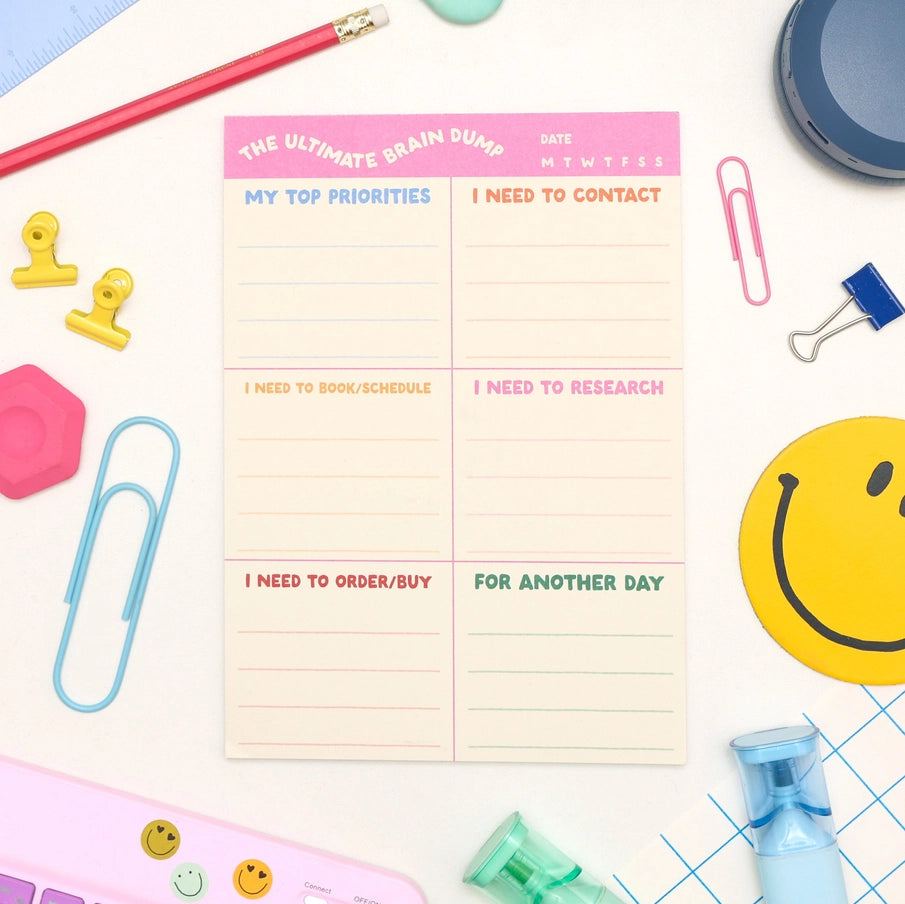 Notebook with a to-do list on a desk with stationery items