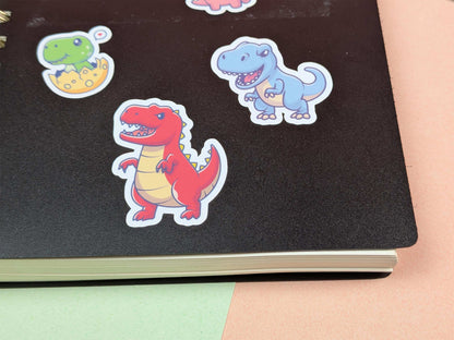 Colorful dinosaur stickers on a black surface