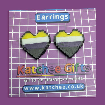 Heart-shaped earrings with a colorful design on a purple grid background with 'Katchee Gifts' branding.