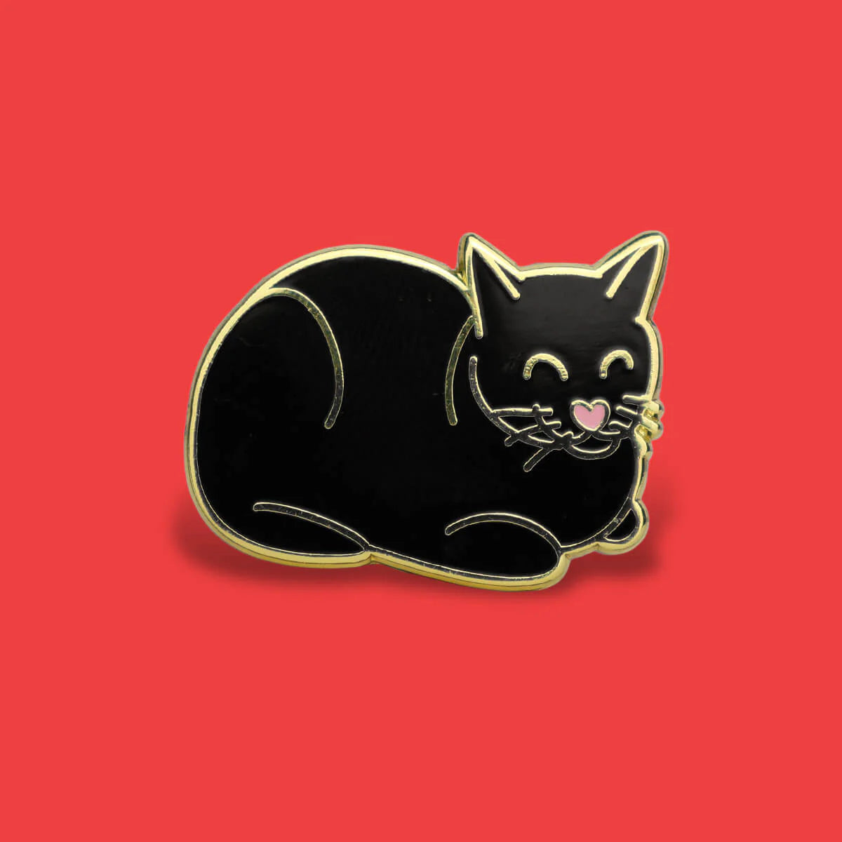 Black cat-shaped pin on a red background