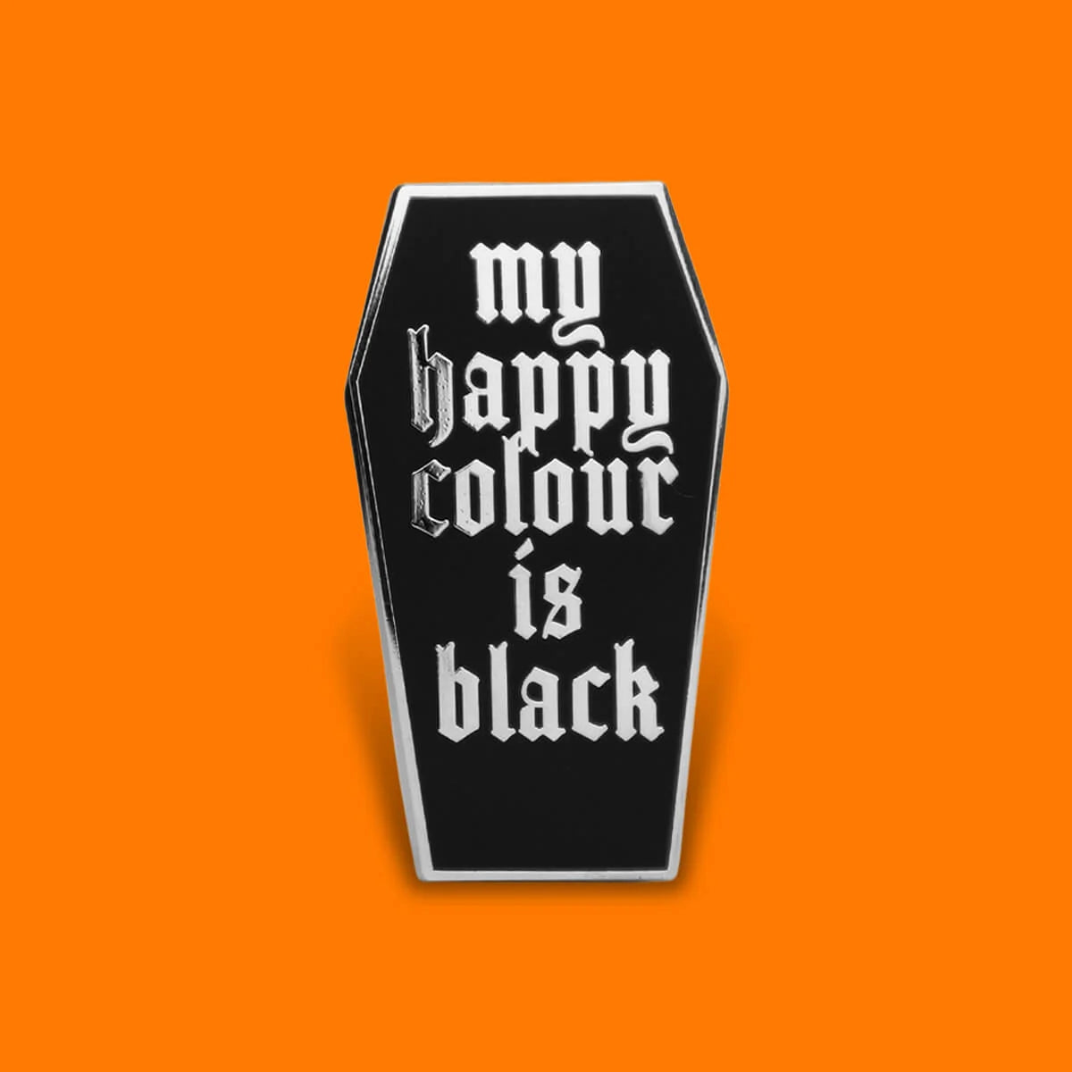 Black coffin-shaped pin with 'my happy colour is black' text on an orange background