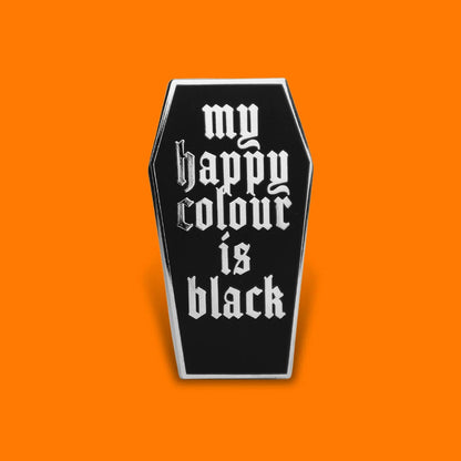 Black coffin-shaped pin with 'my happy colour is black' text on an orange background