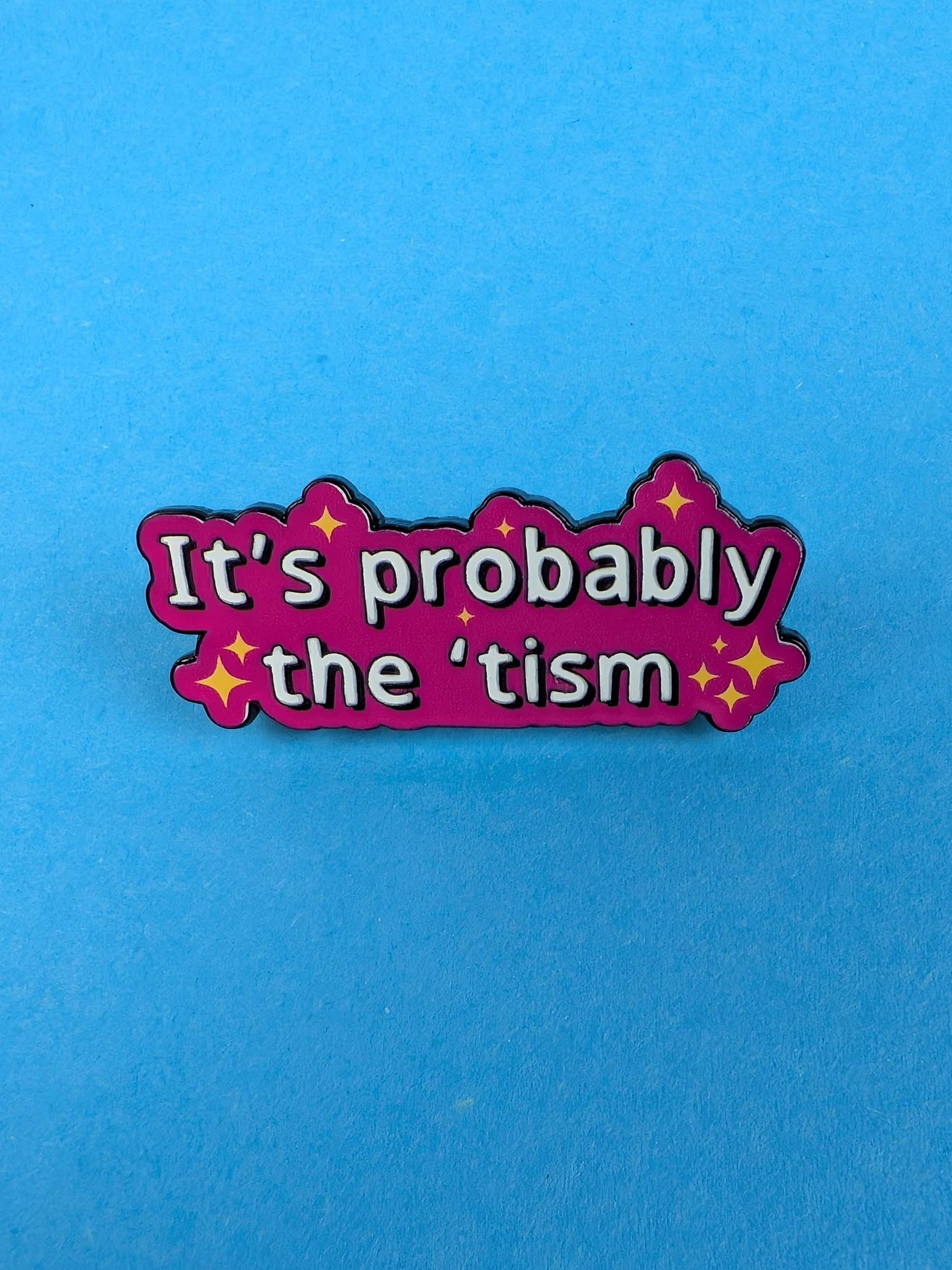 pin with 'It's probably the 'tism' text on a blue background