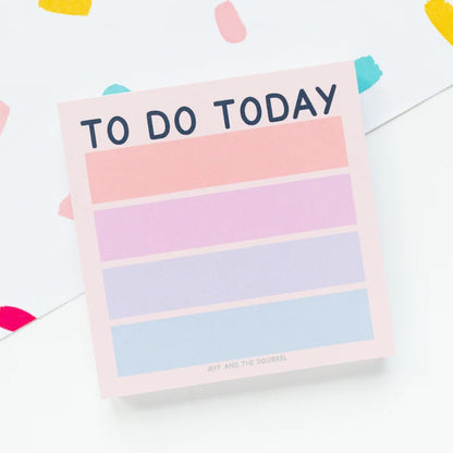 A pastel 'TO DO TODAY' notepad with horizontal pink, lavender, and blue stripes on a white background with colorful confetti accents.