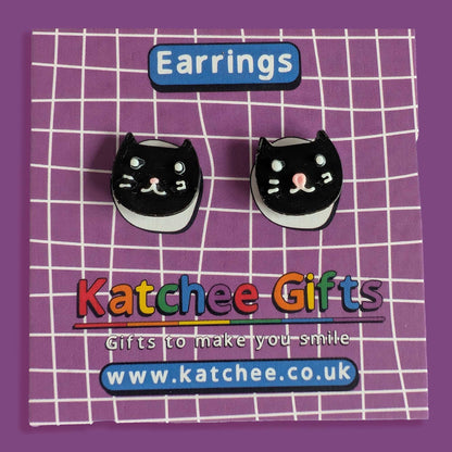 Black cat-shaped earrings on a purple grid background with 'Katchee Gifts' branding.