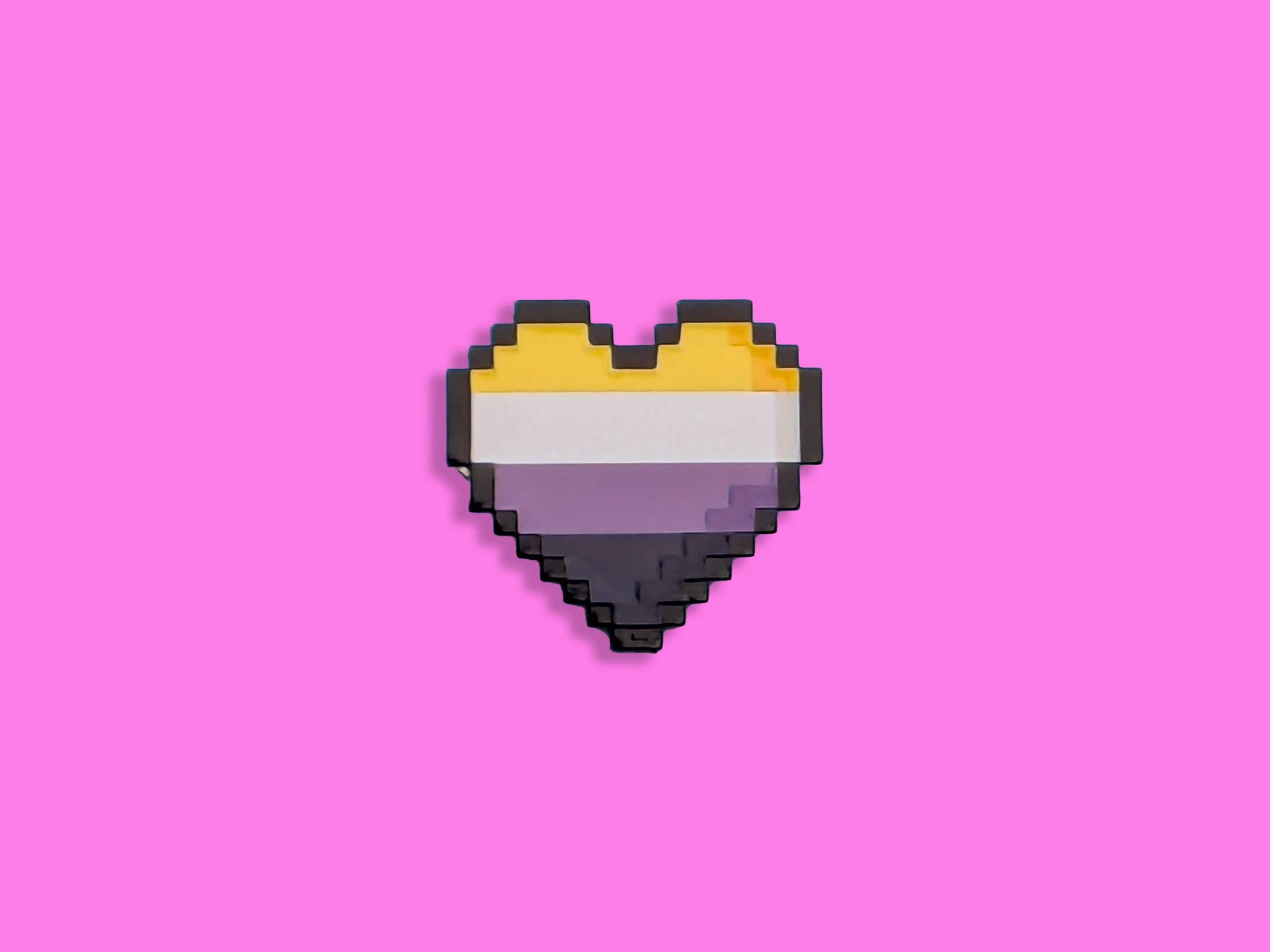 Pixelated heart-shaped badge with a non-binary flag design on a pink background