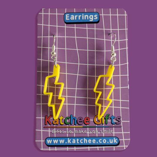 Yellow lightning bolt earrings on a Katchee Gifts card with a purple background